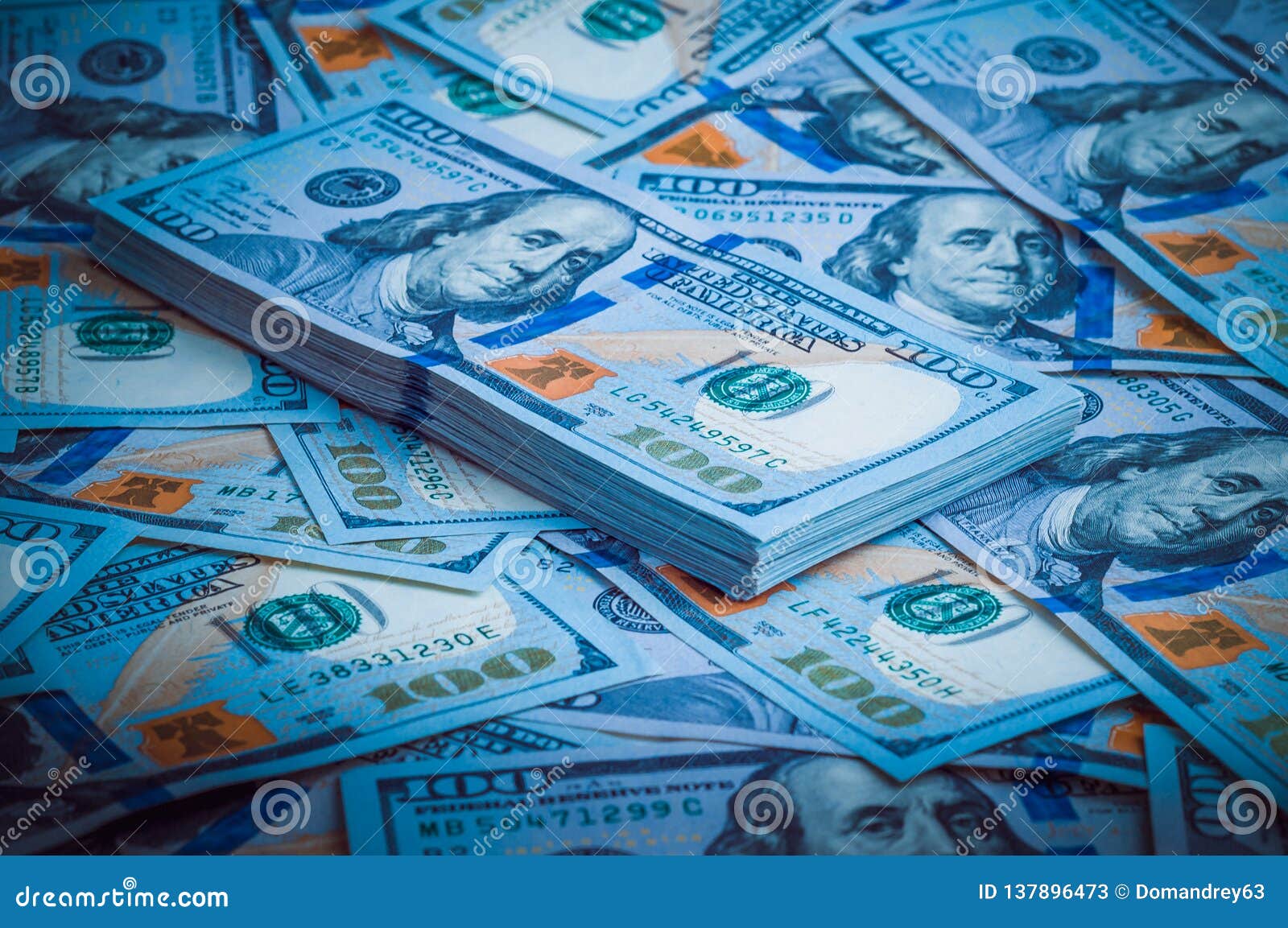 Disciplin Et bestemt Reskyd A Pack of American Dollars on the Background of Hundred Dollar Bills. Blue  Design Stock Image - Image of bills, finance: 137896473