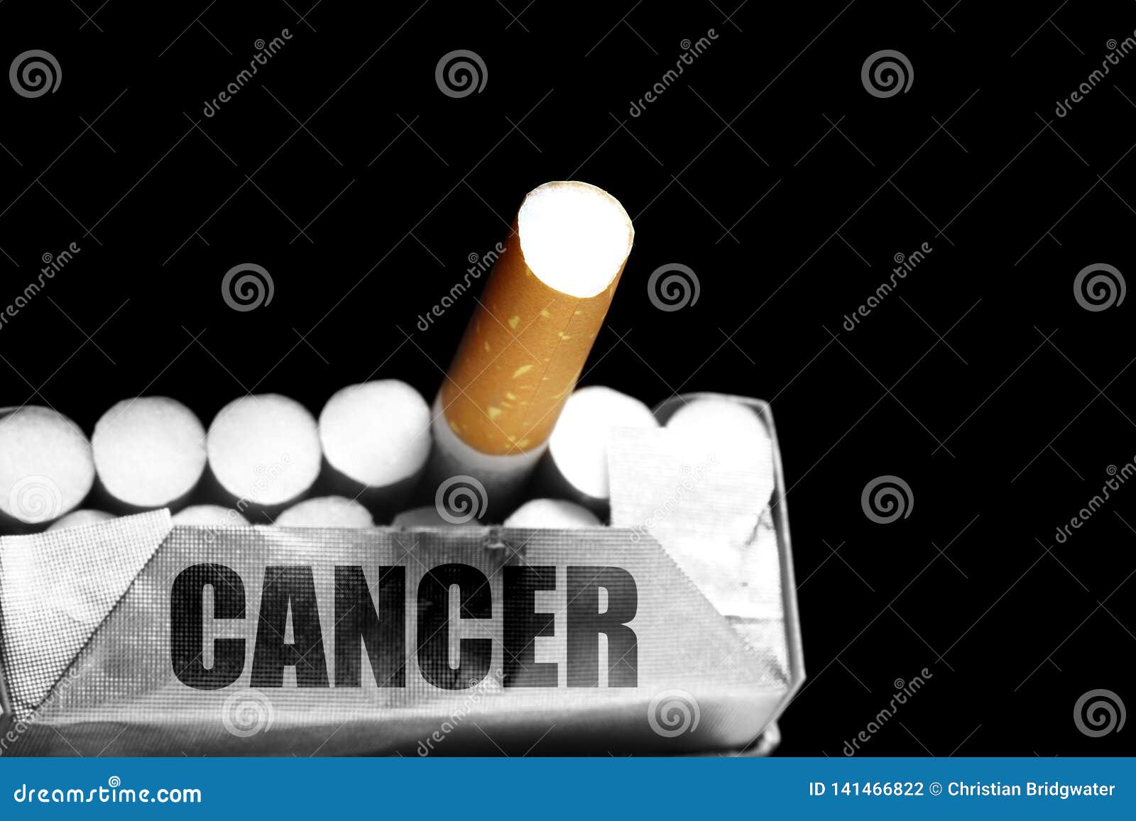 Pack of Cigarettes with the Word Cancer on the Pack with Selective