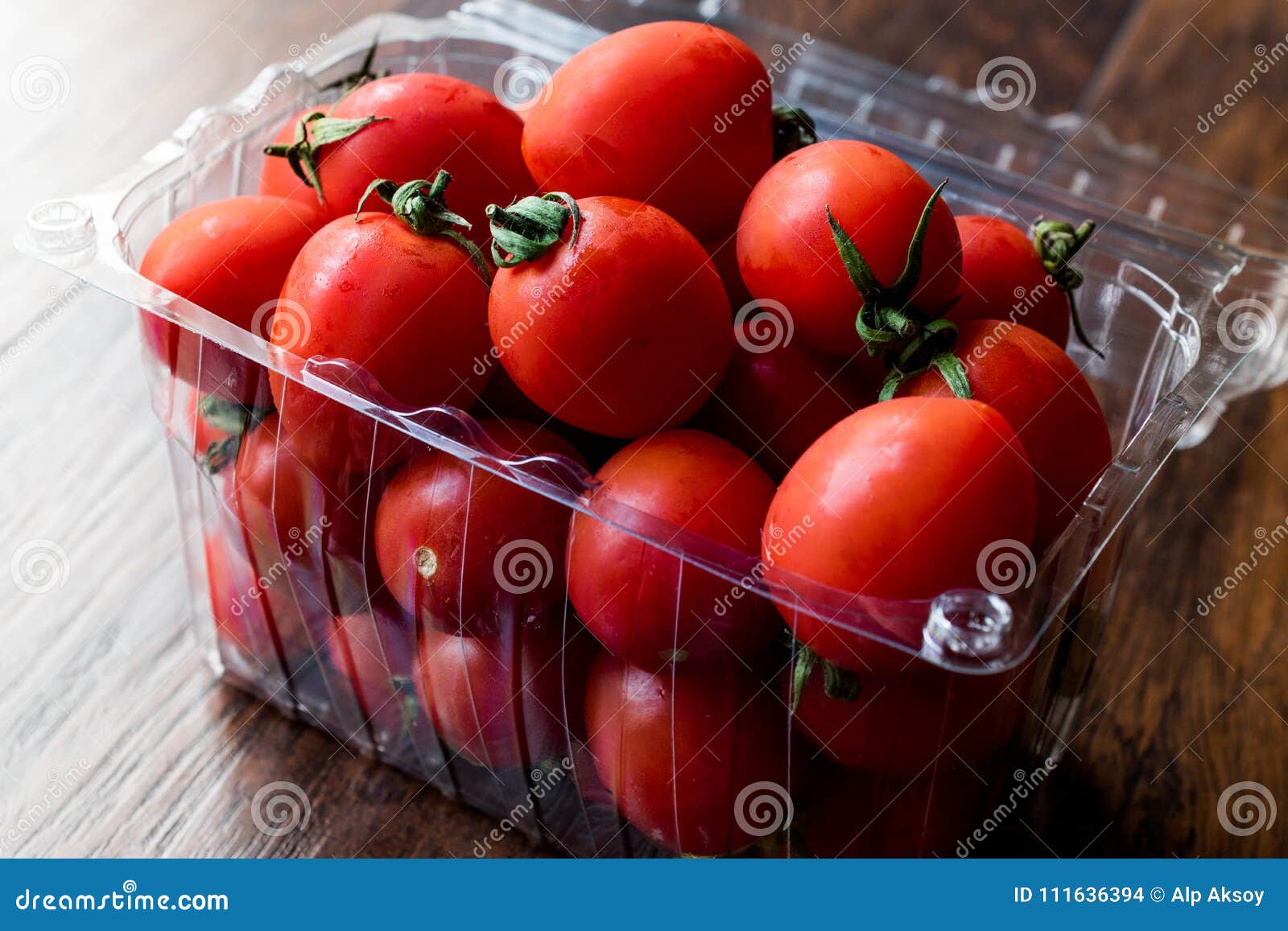 Package of Cherry Tomatoes in Plastic Box / Container. Stock Photo