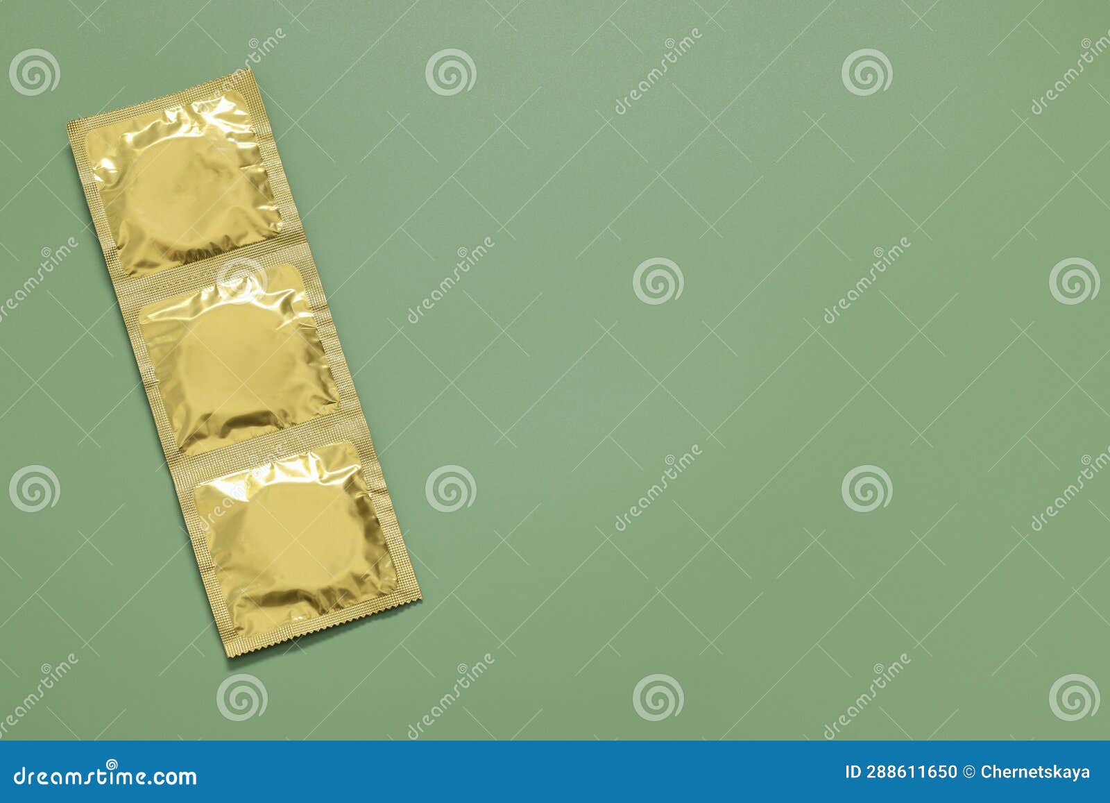 Packaged Condoms On Light Green Background Top View With Space For