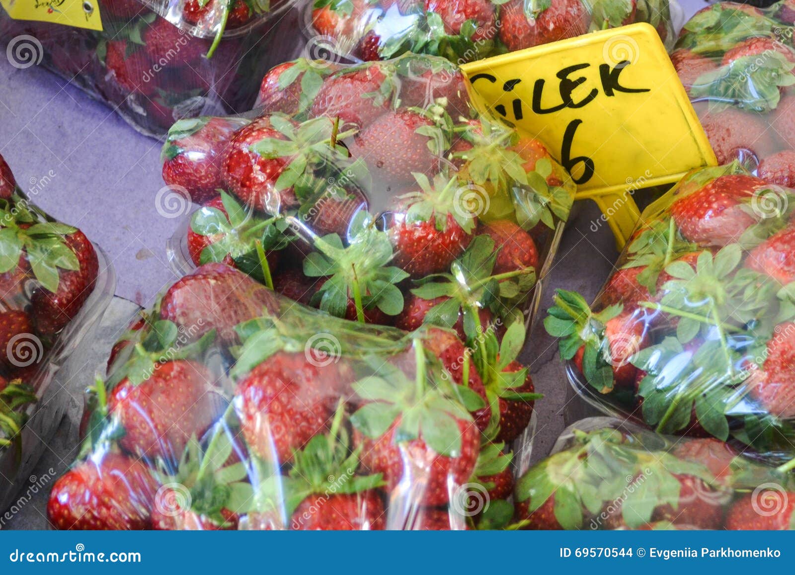 Packaged Strawberries Under Plastic Sheets Sold on the Market Stock