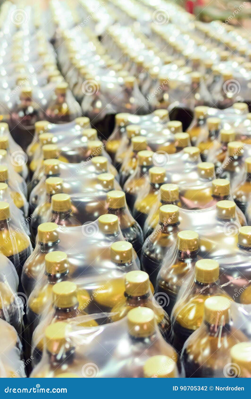 Packaging Lot of Plastic Bottles at the Brewery. Stock Photo Image of
