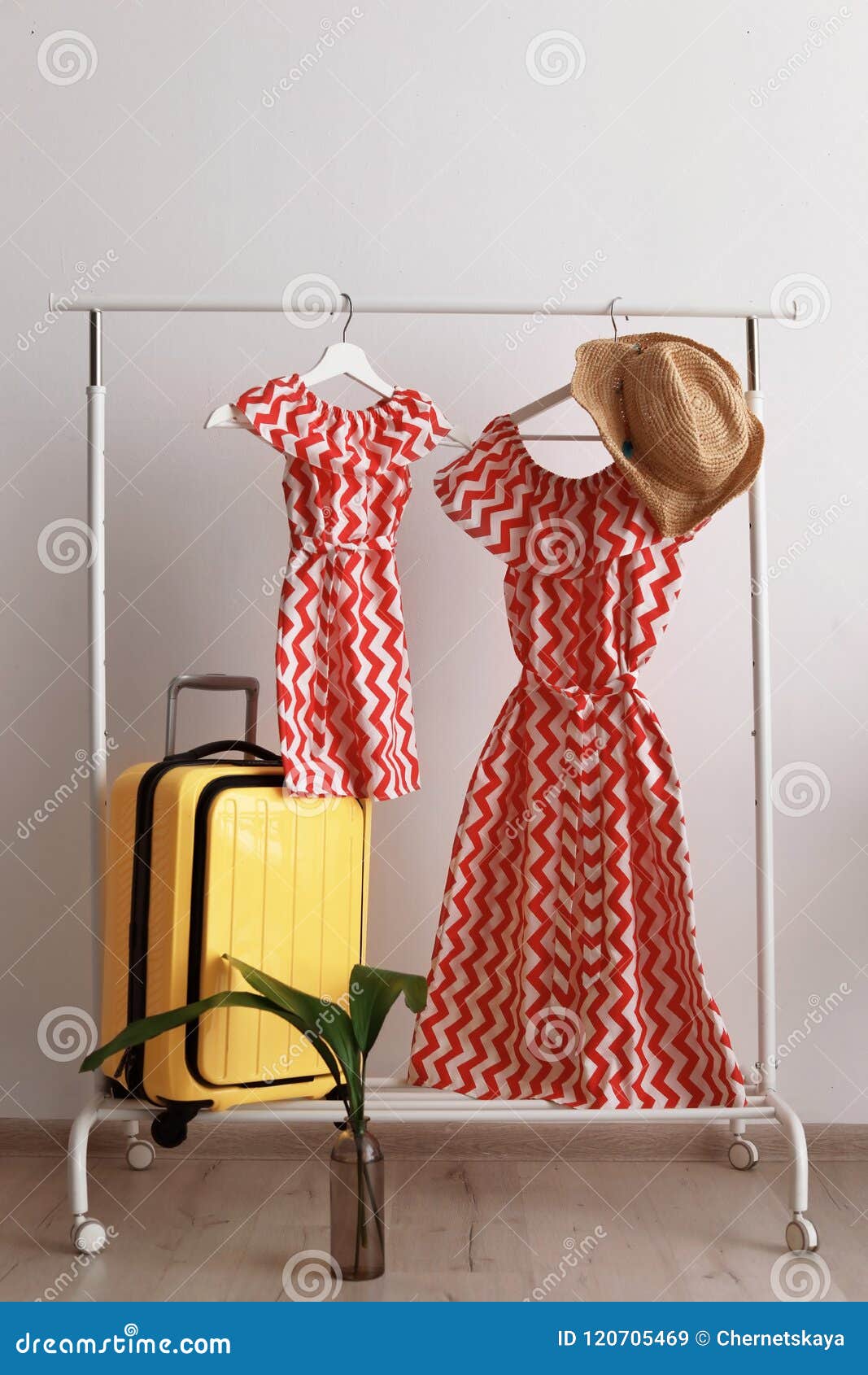 Packed Yellow Suitcase and Rack with Clothes Stock Image Image of