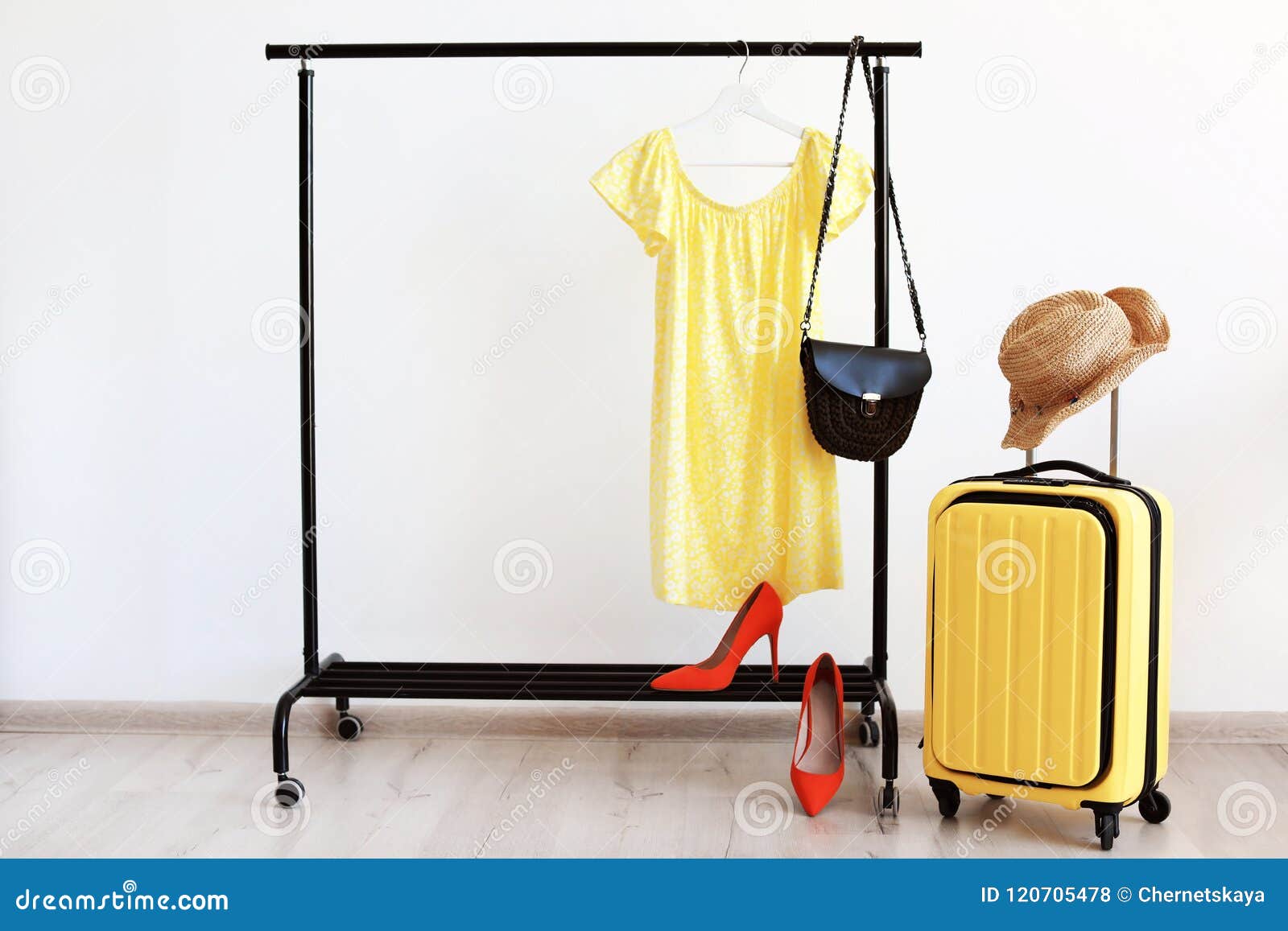 Packed Yellow Suitcase and Rack with Clothes Stock Photo Image of