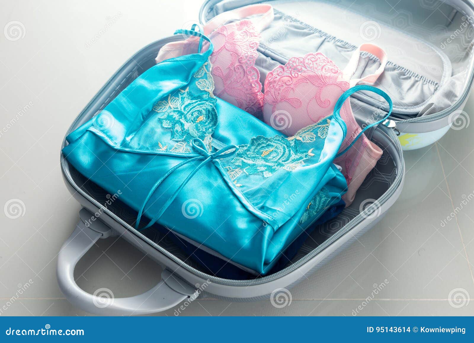 Packing Clothes into Travel Bag Stock Photo - Image of elegant, indoor:  95143614