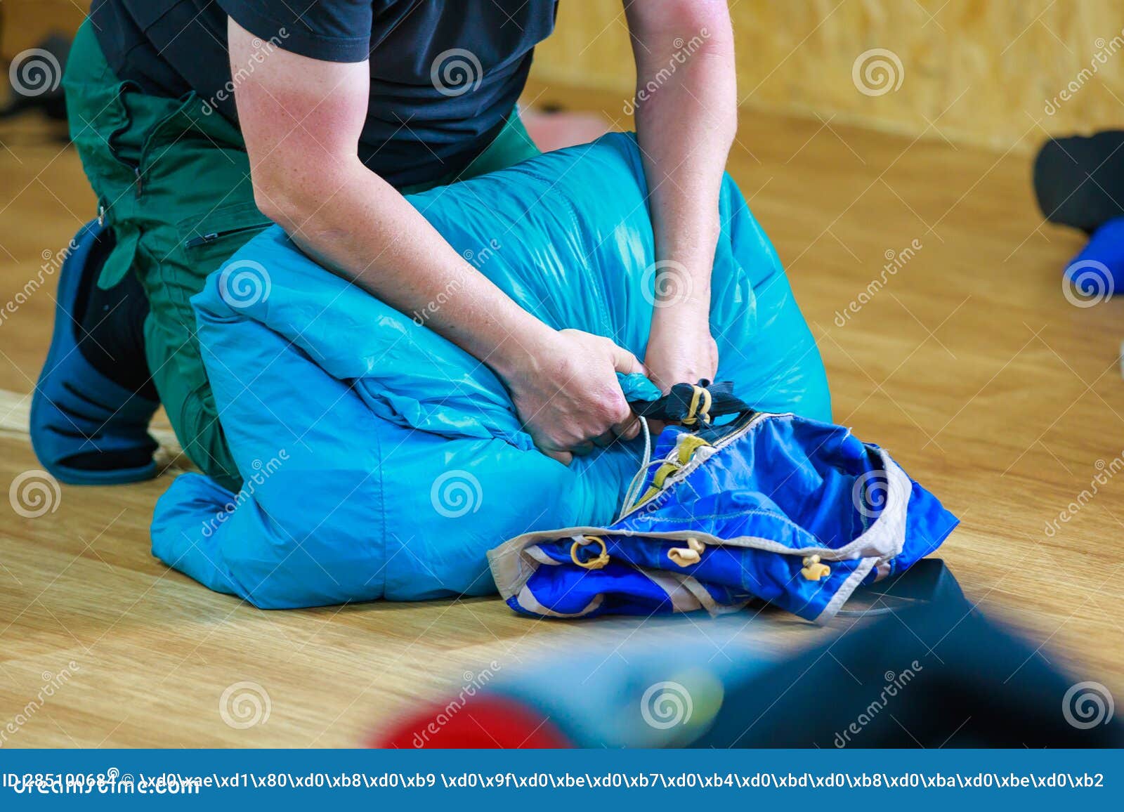 Packing a Parachute into a Backpack. Stock Photo - Image of indoor ...