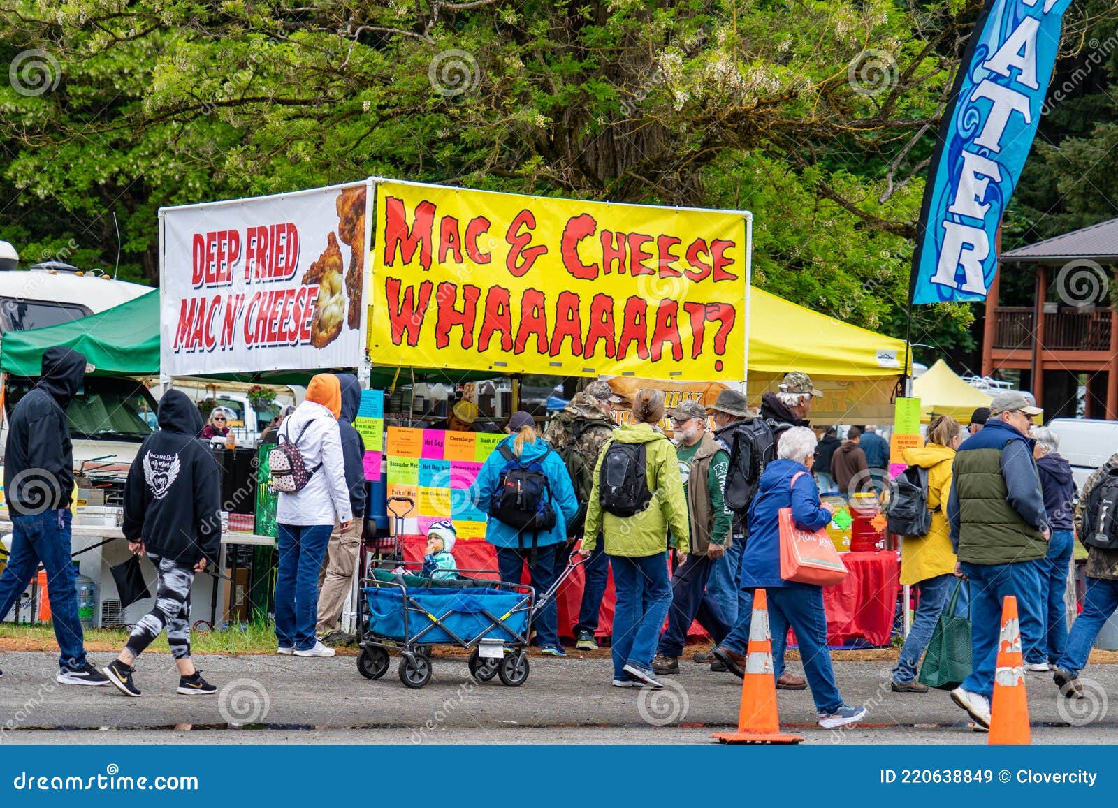 Food Booth and Customers at Annual Community Flea Market Editorial