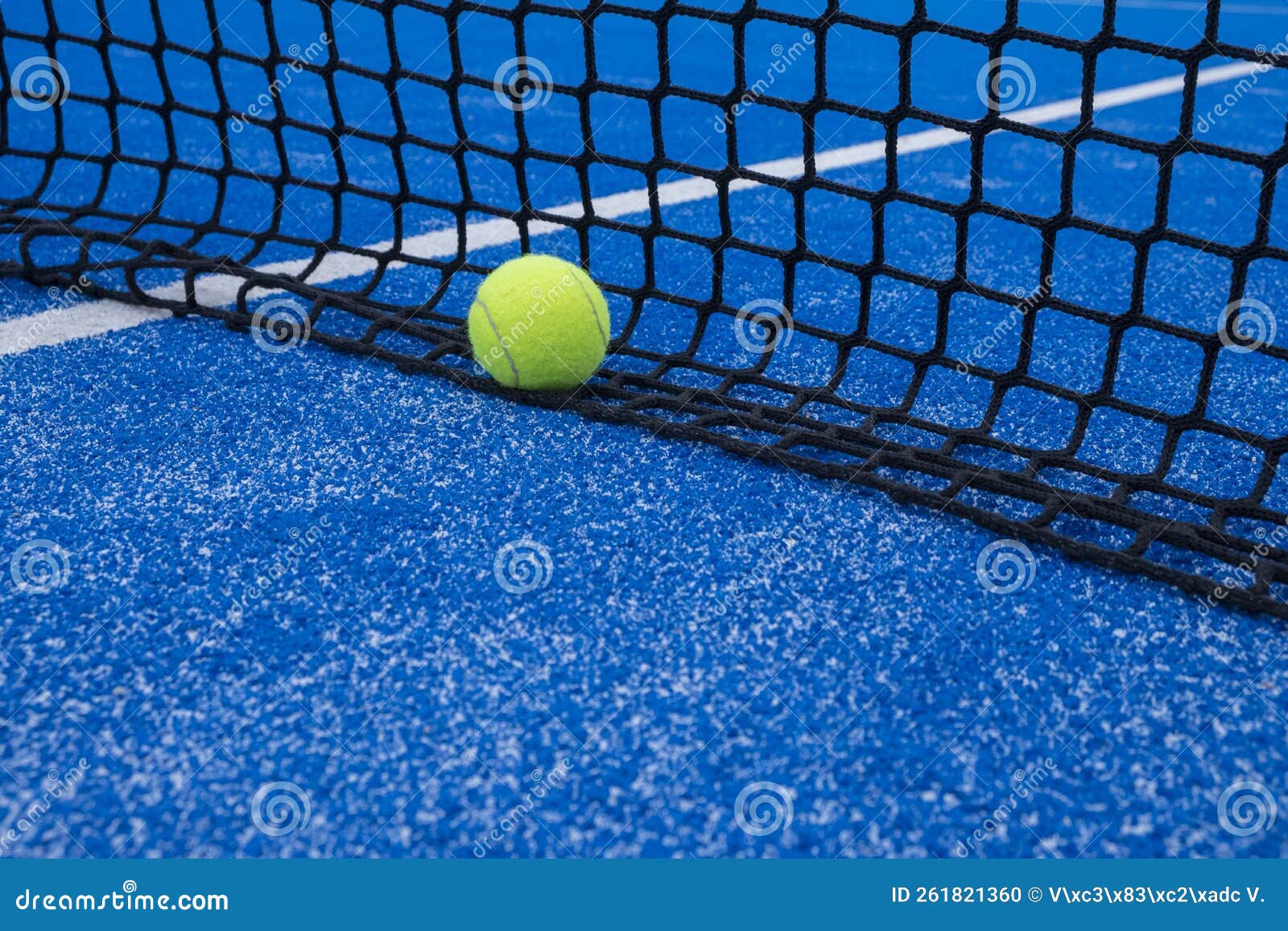 Paddle Tennis Ball by the Net of a Paddle Tennis Court Stock Photo
