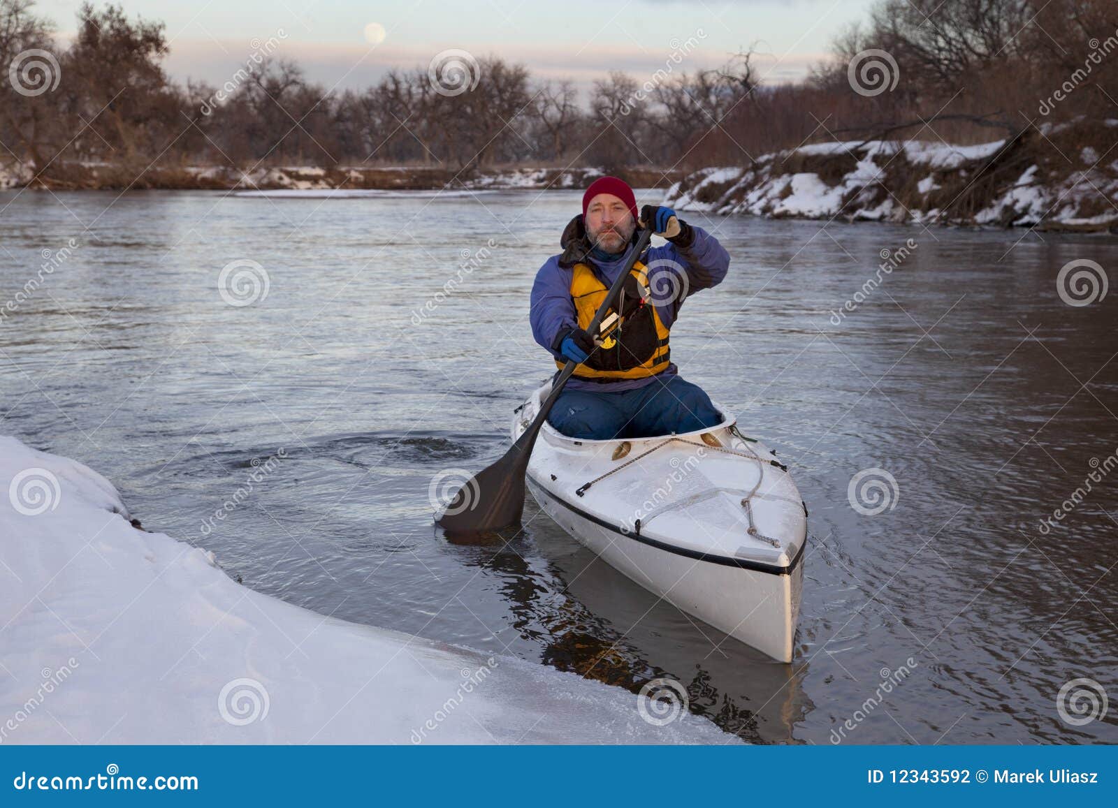 Paddling Canoe on a Winter River Stock Photo Image of winter, mature 12343592