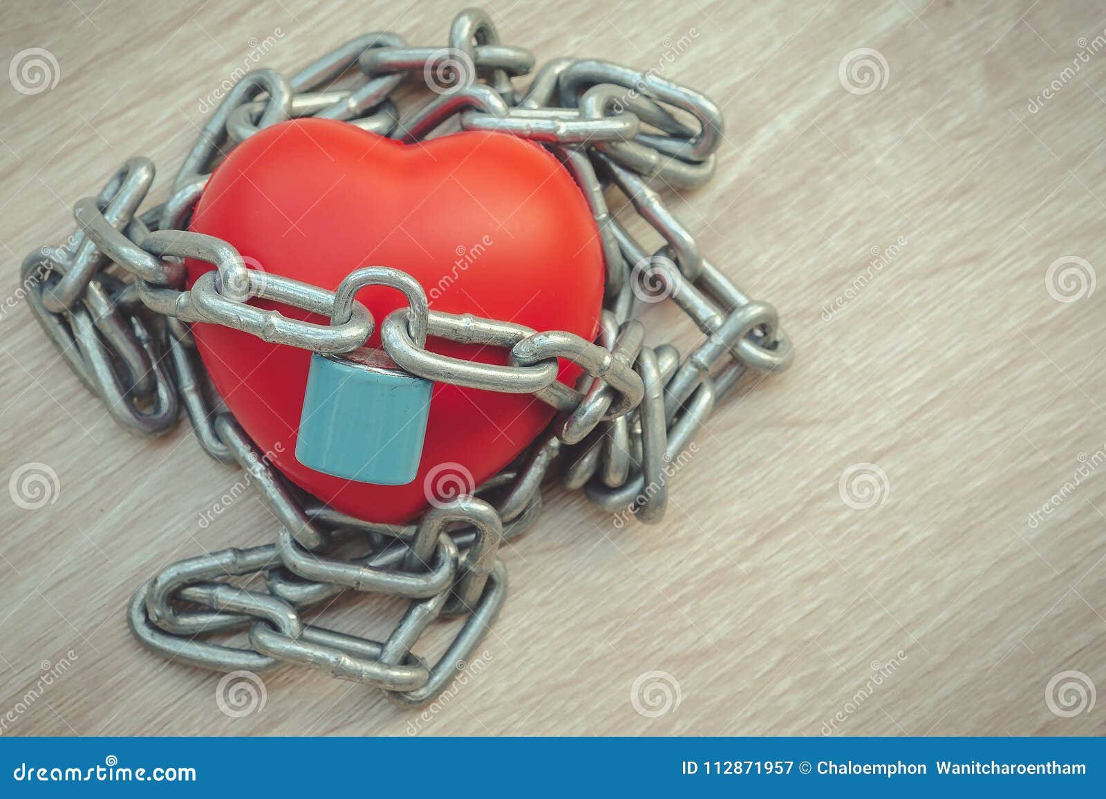 Padlock and Chain Locking a Red Heart on the Wooden. Stock Image