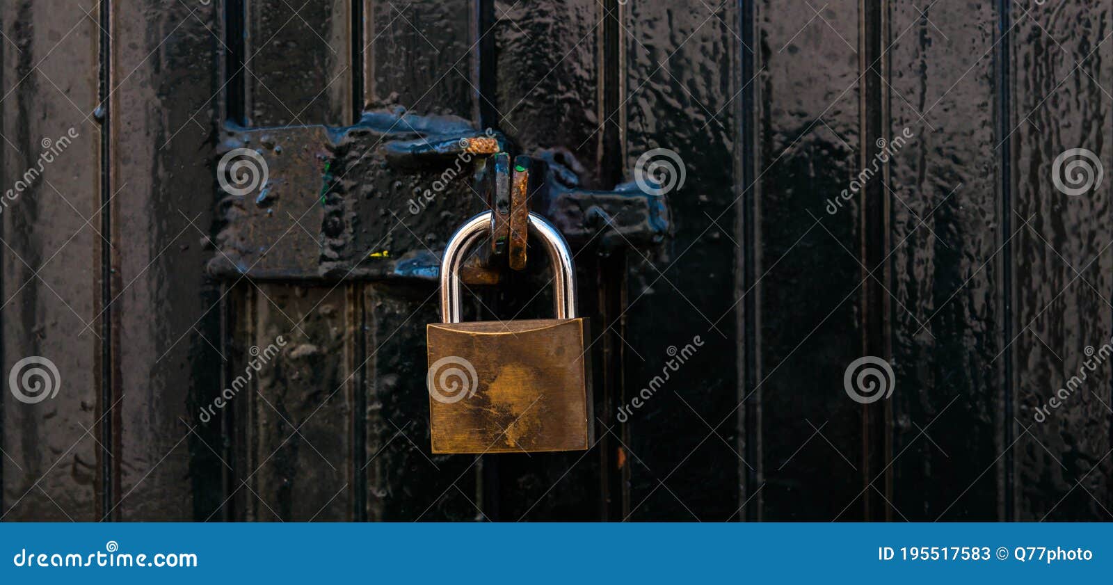 Padlock Latch on Black Metal Gate, Element for Secure Property Lock