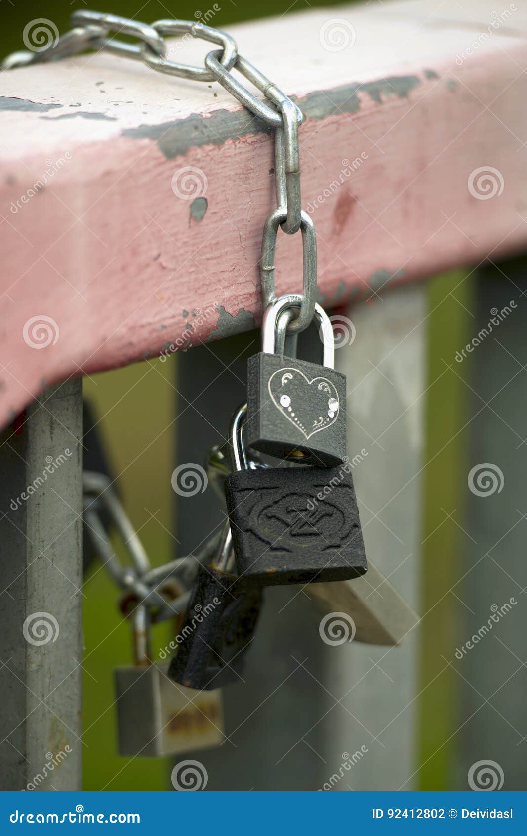 Padlocks on a chain stock photo. Image of ground, focus 92412802