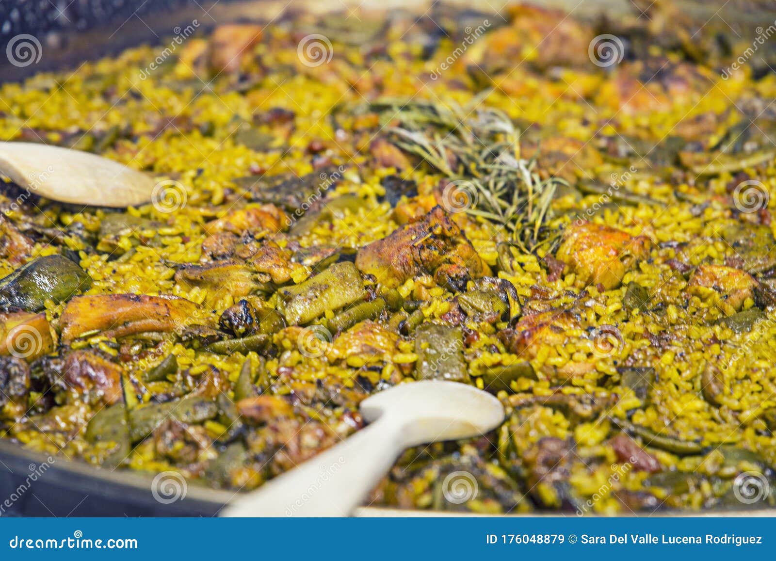 Paella Chicken and Rabbit Dish in Its Pot Served on the Table with