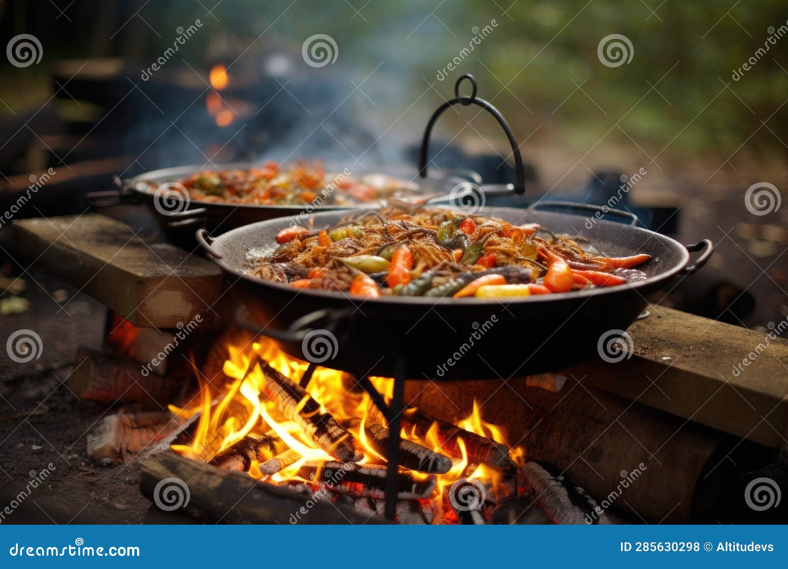 Paella Cooking Outdoors on an Open Fire, Traditional Style Stock Photo