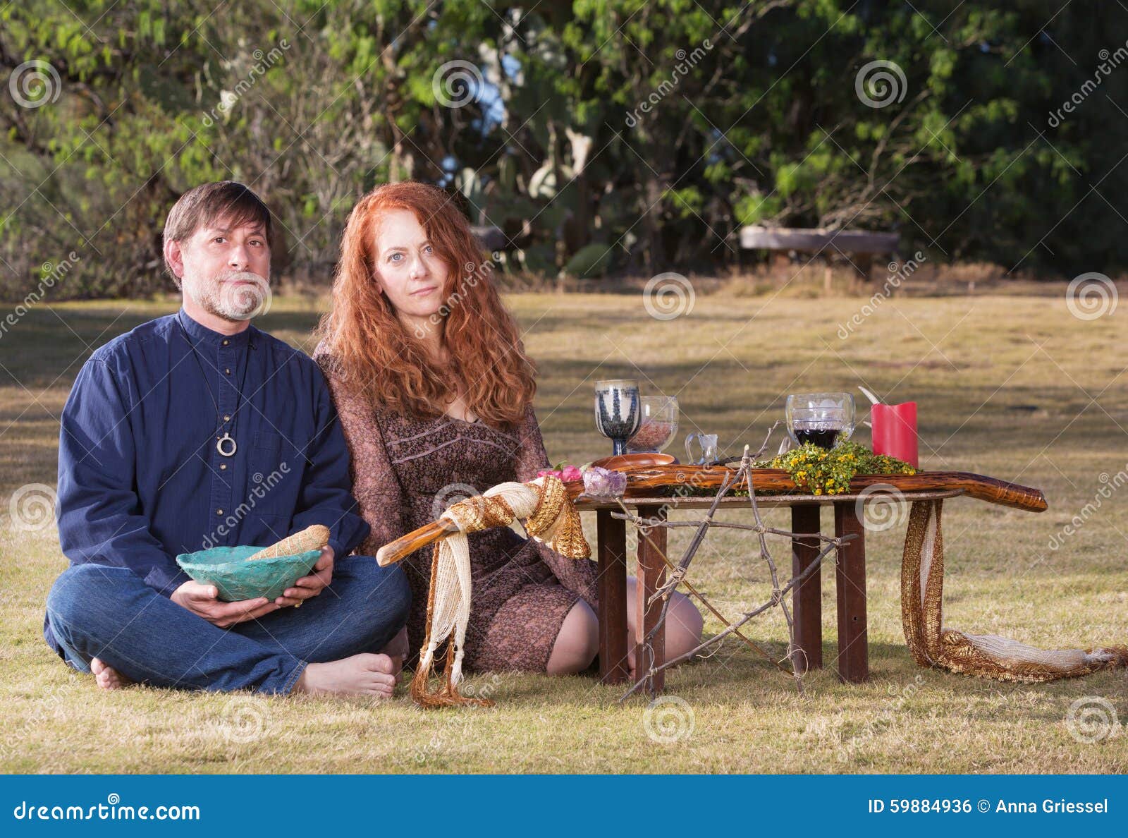 pagans with smudge stick and altar