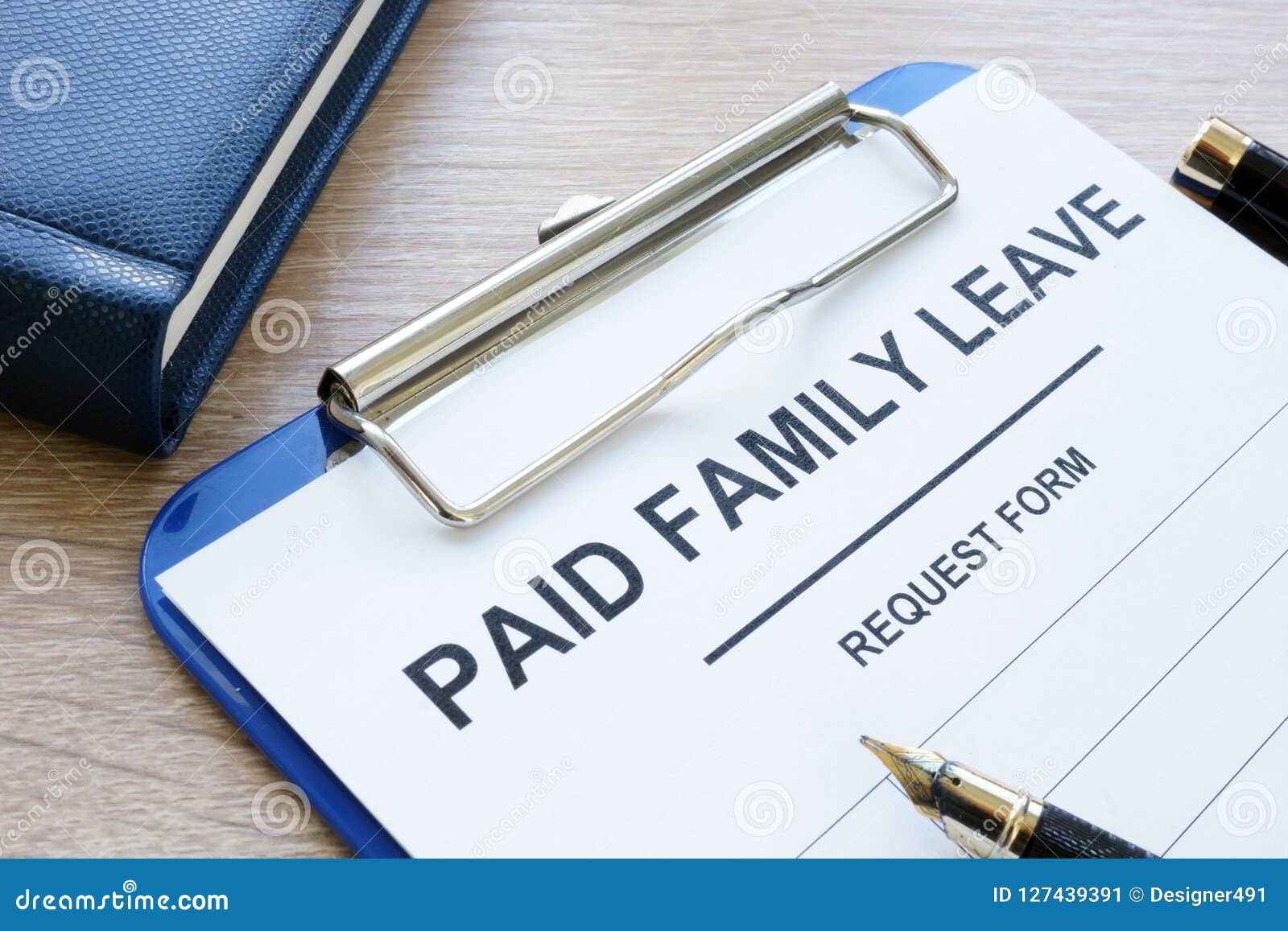 paid family leave form in clipboard and notepad.