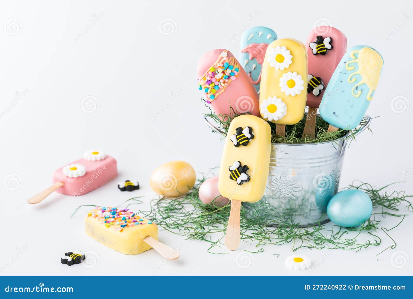 A Pail Filled with Homemade Cakesicles for Easter, with Copy Space To