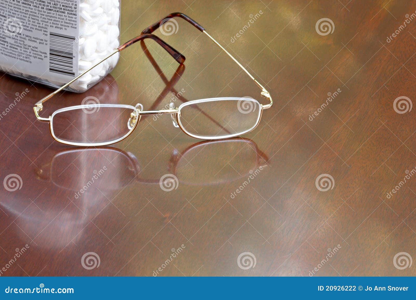 Pain Relievers and Reading Glasses on Desk Stock Photo Image of