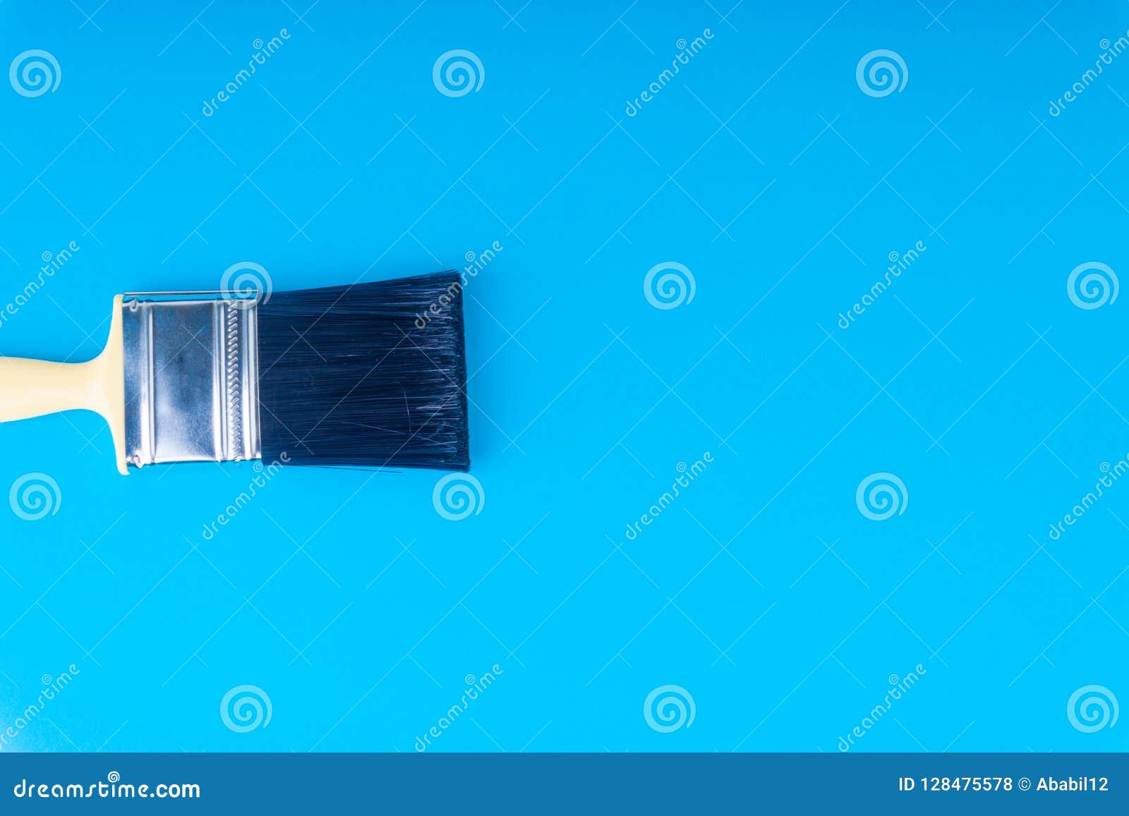 paint brush on blue colour background