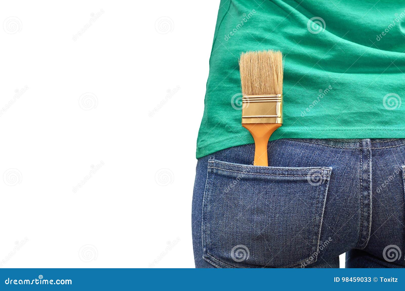 Paint Brush in the Pocket of Blue Jeans. Isolated on White Background