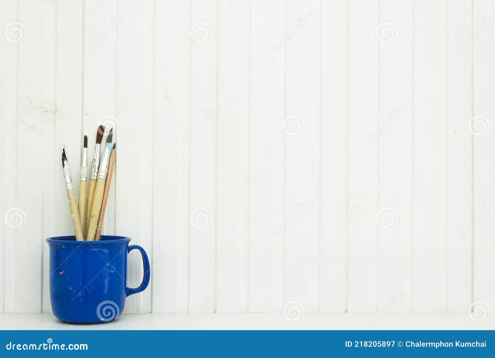 A Paint Brush on Table Over the White Wall. Stock Image Image of