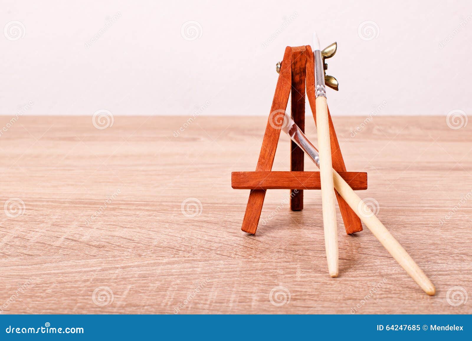 Paint brushes and an easel stock image. Image of blank 64247685