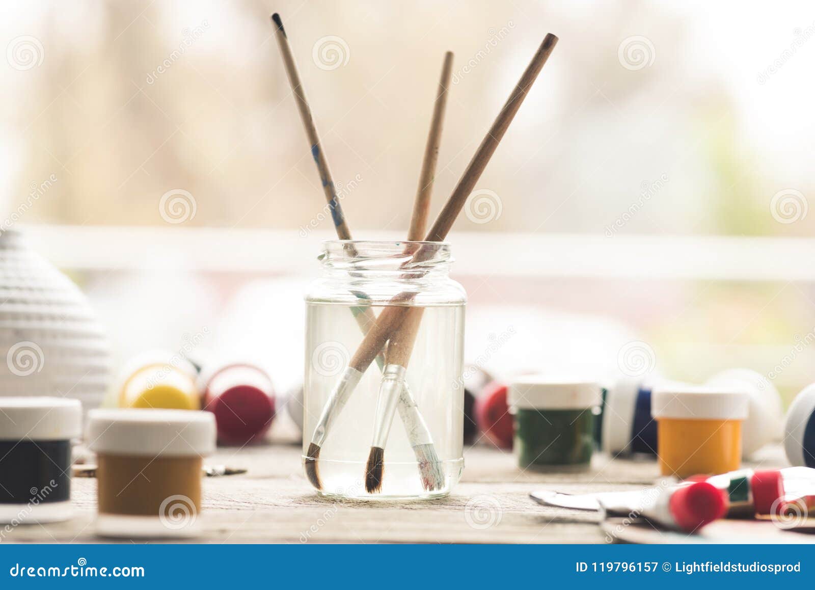 Paint brushes in solvent stock image. Image of poster 119796157