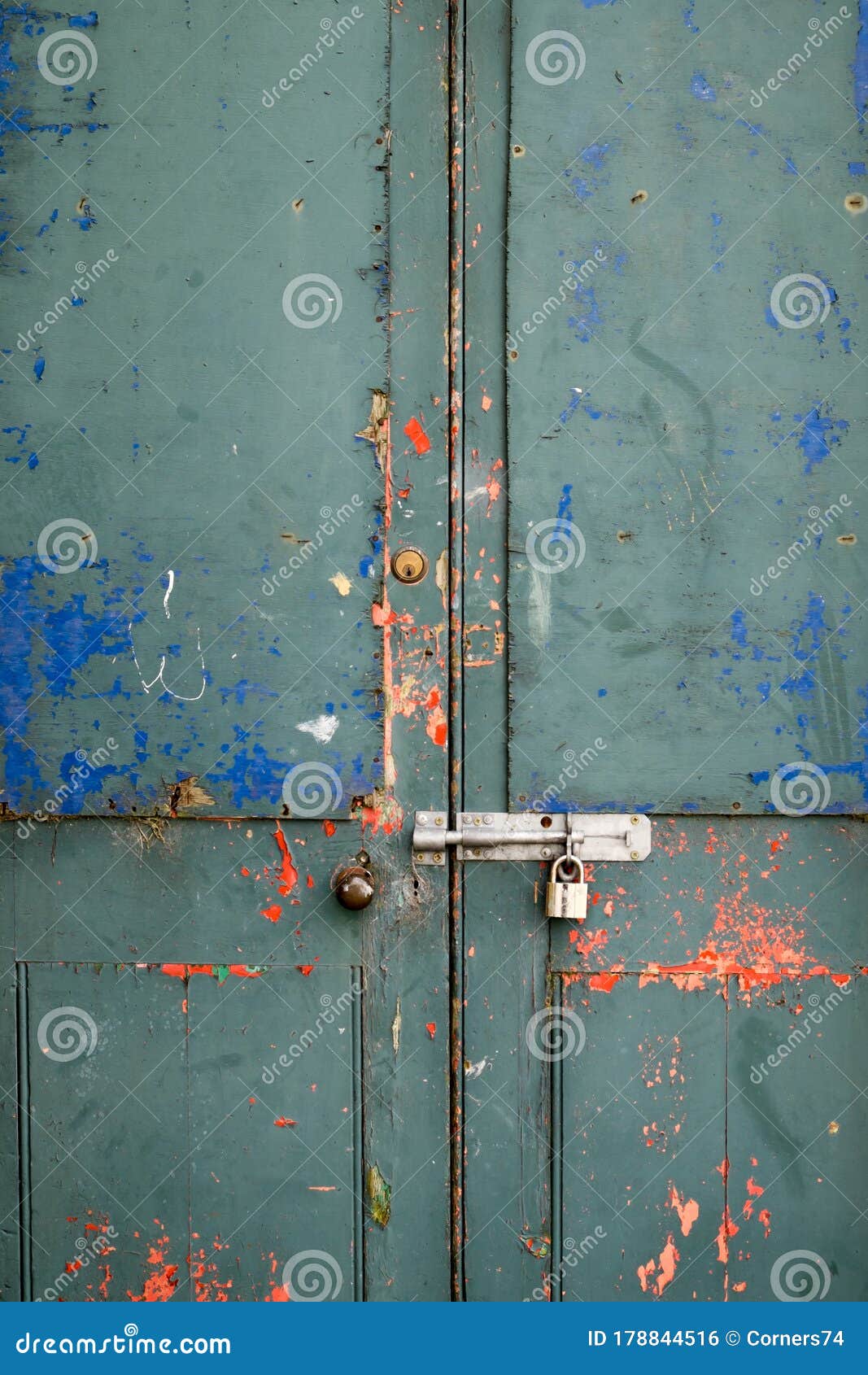 Paint Flaking Off a Disused Locked Up Door with Padlock and Grungey ...