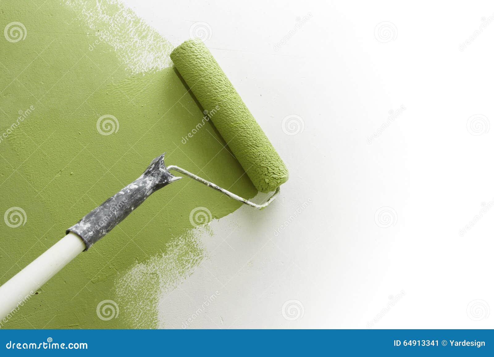 Paint Roller Applying Paint on White Wall, Home Improvements Stock