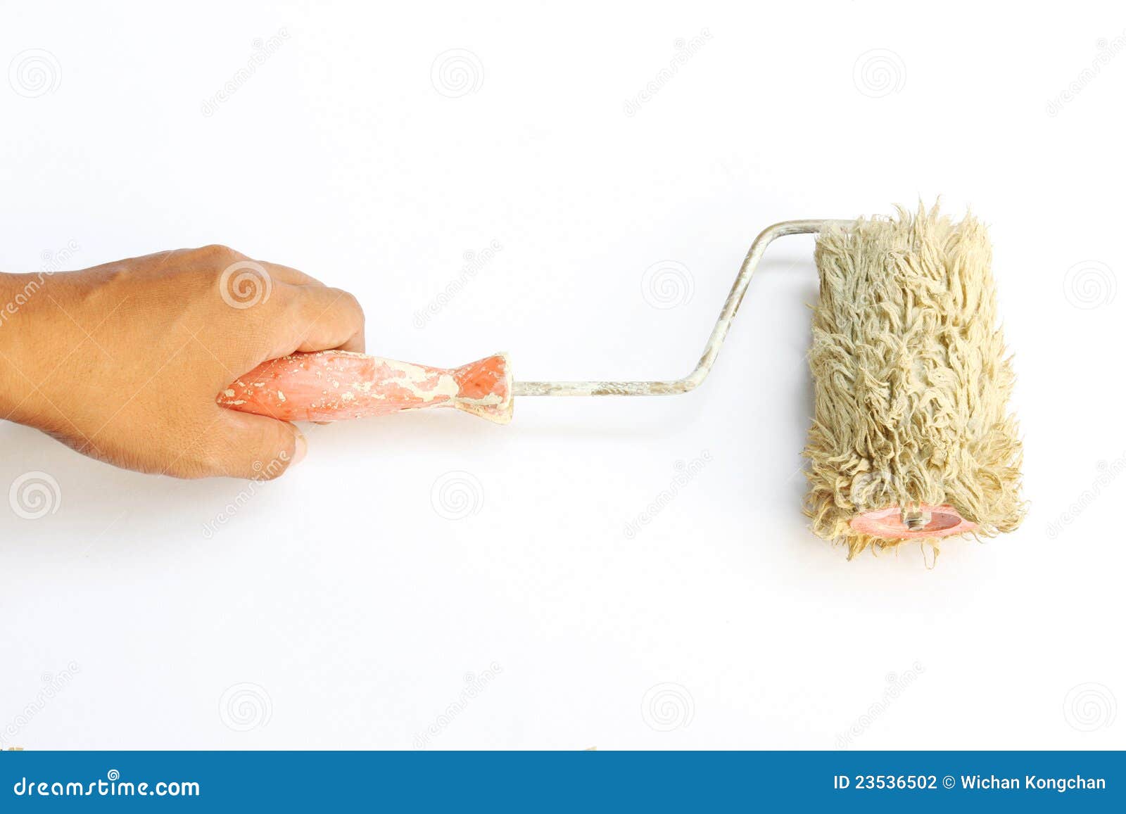 Paint roller in hand stock photo. Image of improvement 23536502