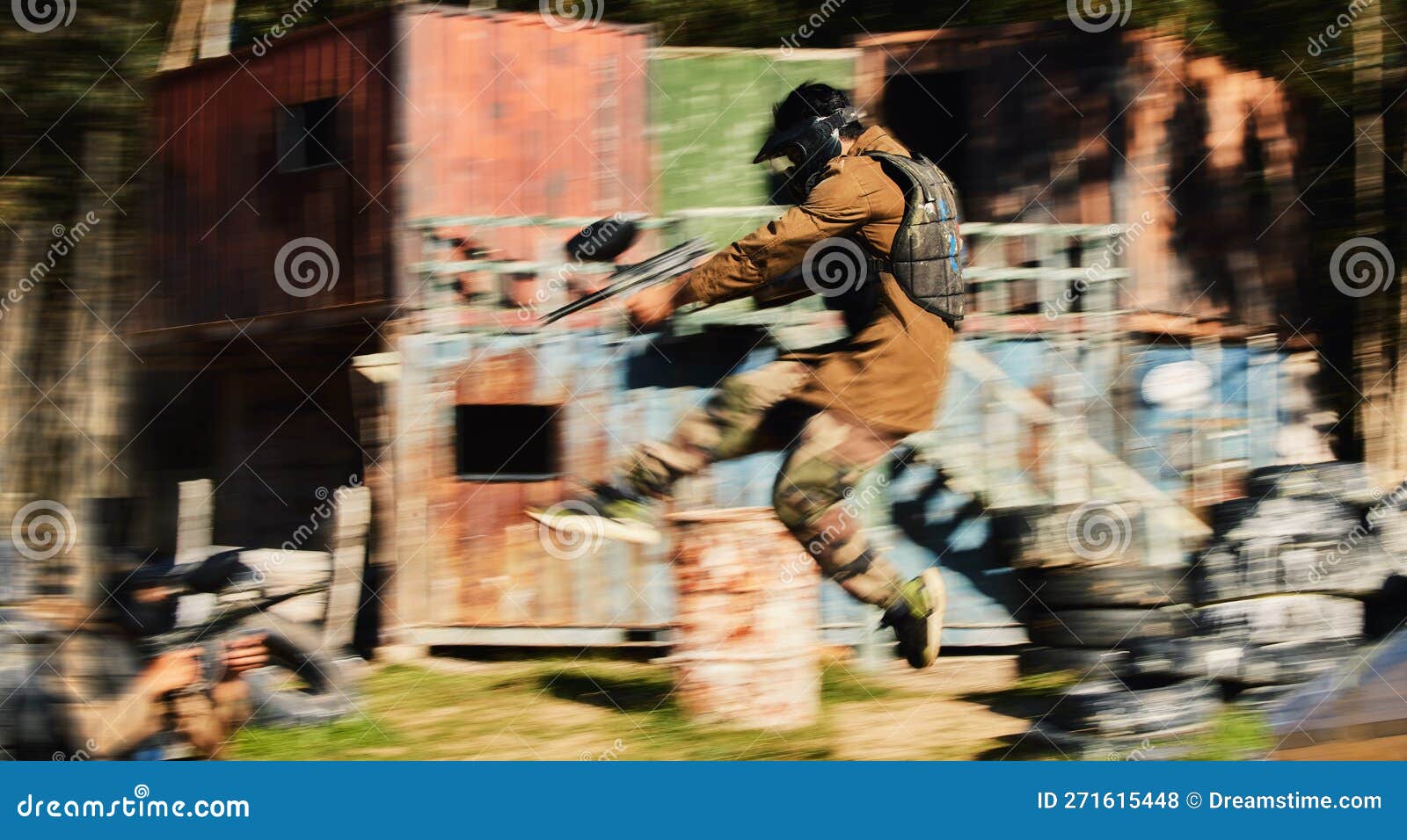 Paintball, Man Jump and Aim Gun at Target, Military Tactics at Shooting Range and War Game for Sports Outdoor