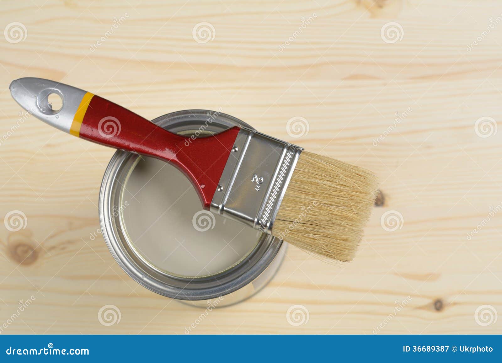 cleaning a paintbrush covered in wood stain with turpentine cleaning a paintbrush covered in wood stain with turpentine