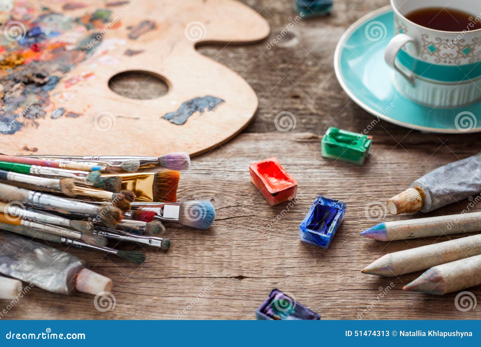 Paintbrushes, Artist Palette, Pencils, Coffee Cup and Paints Stock