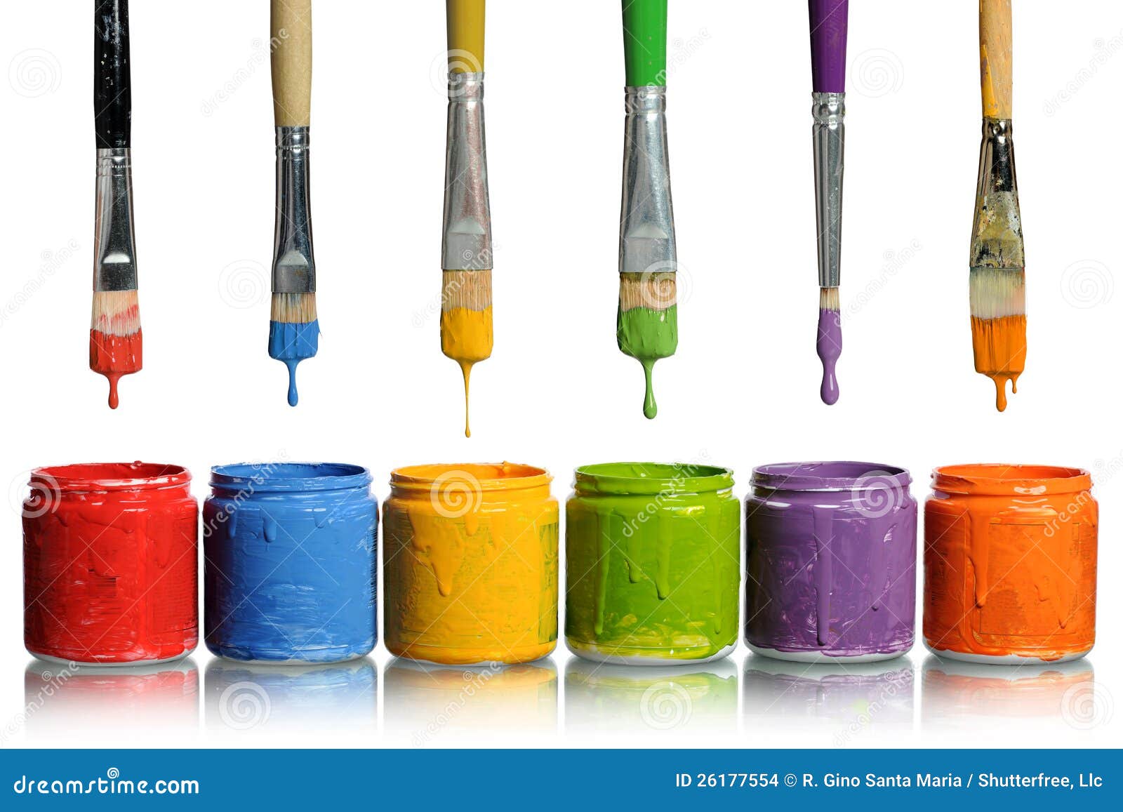 paintbrushes dripping into paint containers