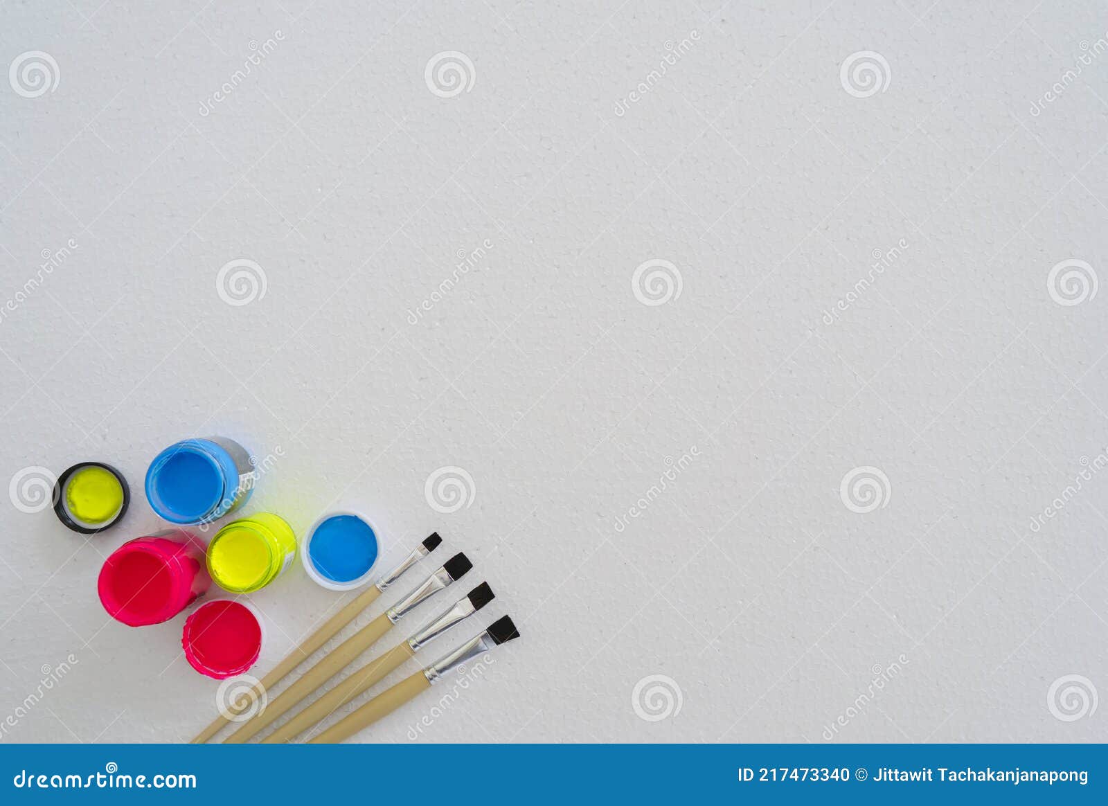 Paintbrushes and Plastic Paints are Placed on a Foam Pad Stock Photo