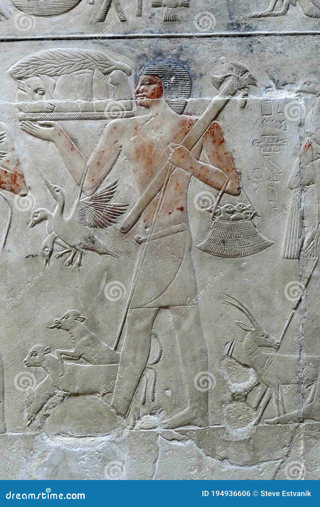 painted bas relief figures showing daily life in ancient egypt