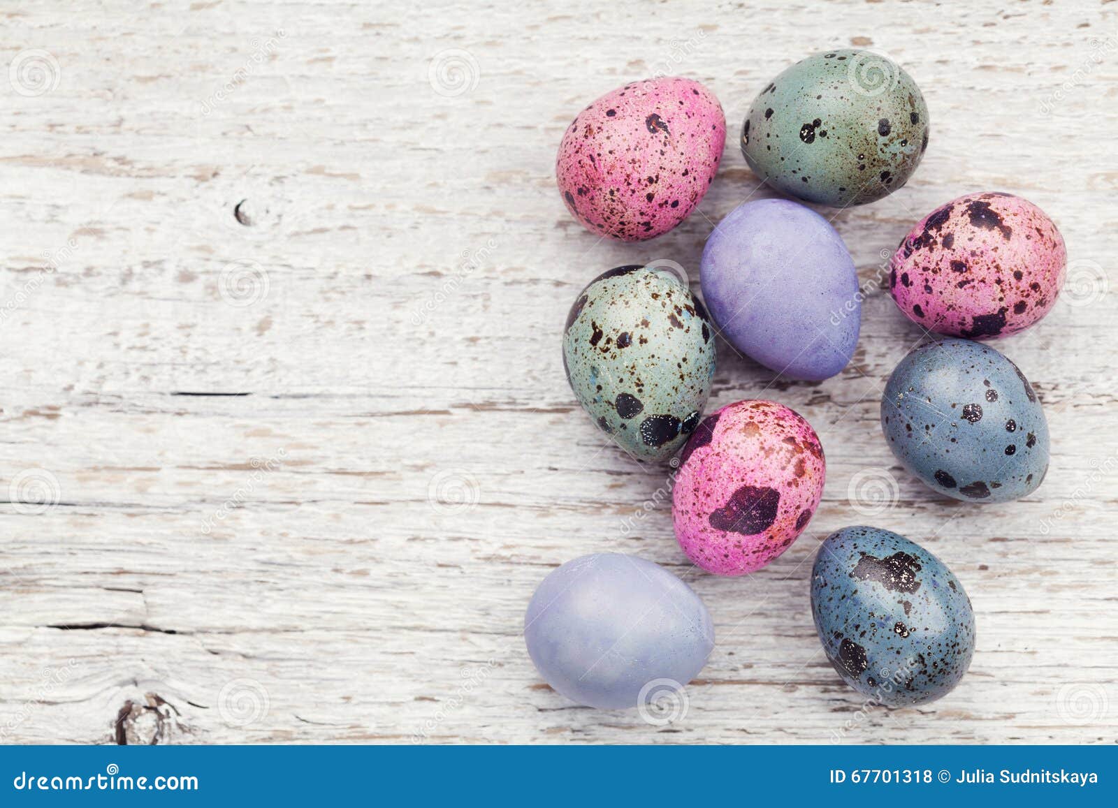 painted easter eggs on rustic wooden background from above, vintage style