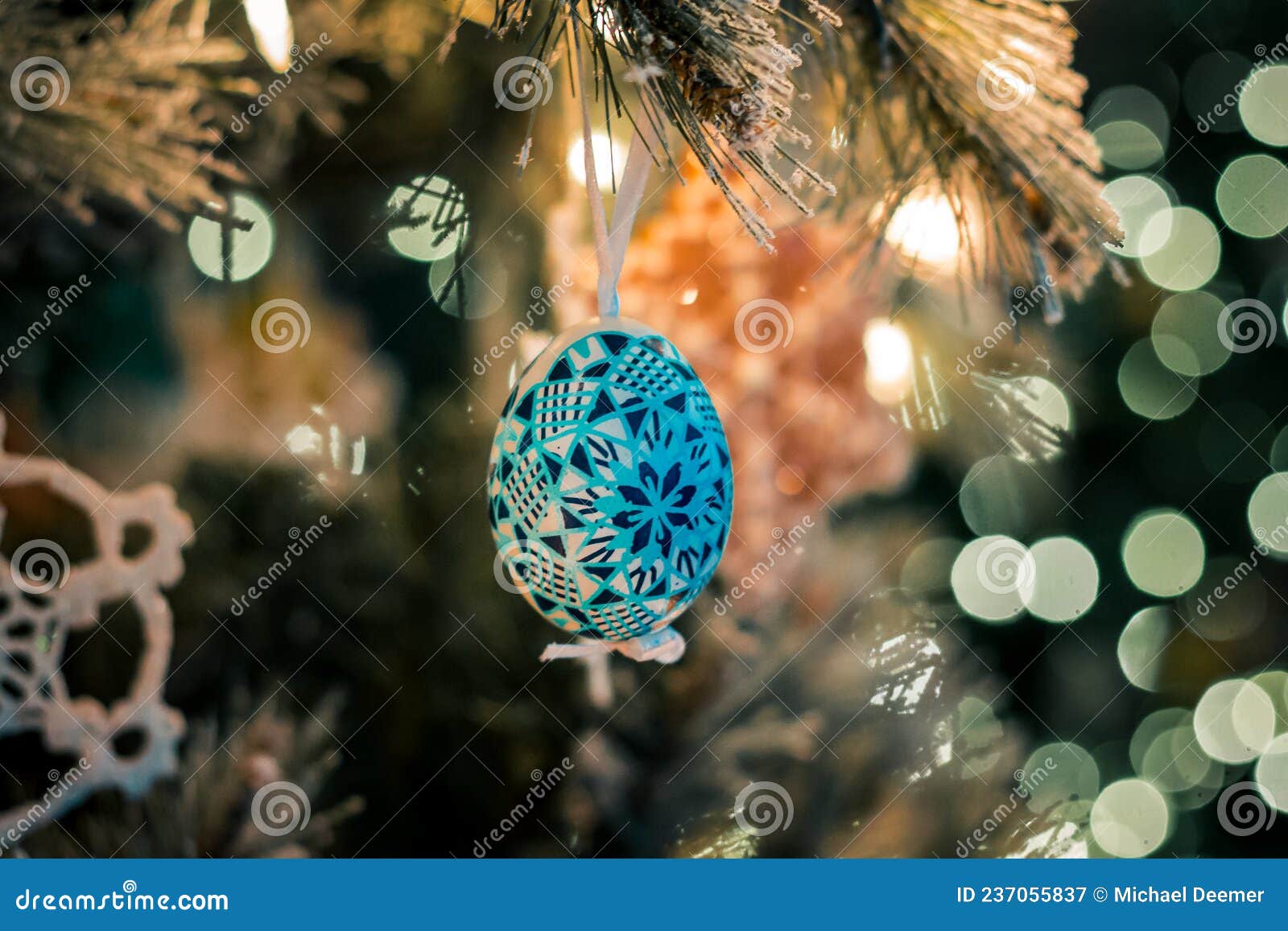 Painted Egg Ornament Hung in a Christmas Tree Editorial Photography