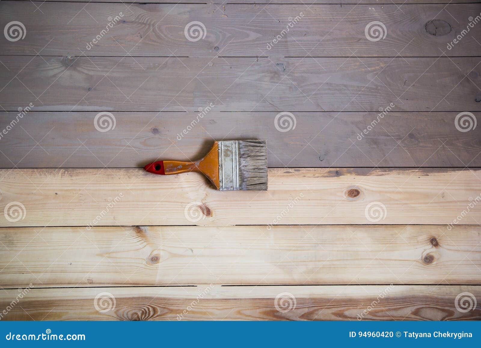 Painted Wooden Floor with Grey Colour and a Brush on the Floor. Stock