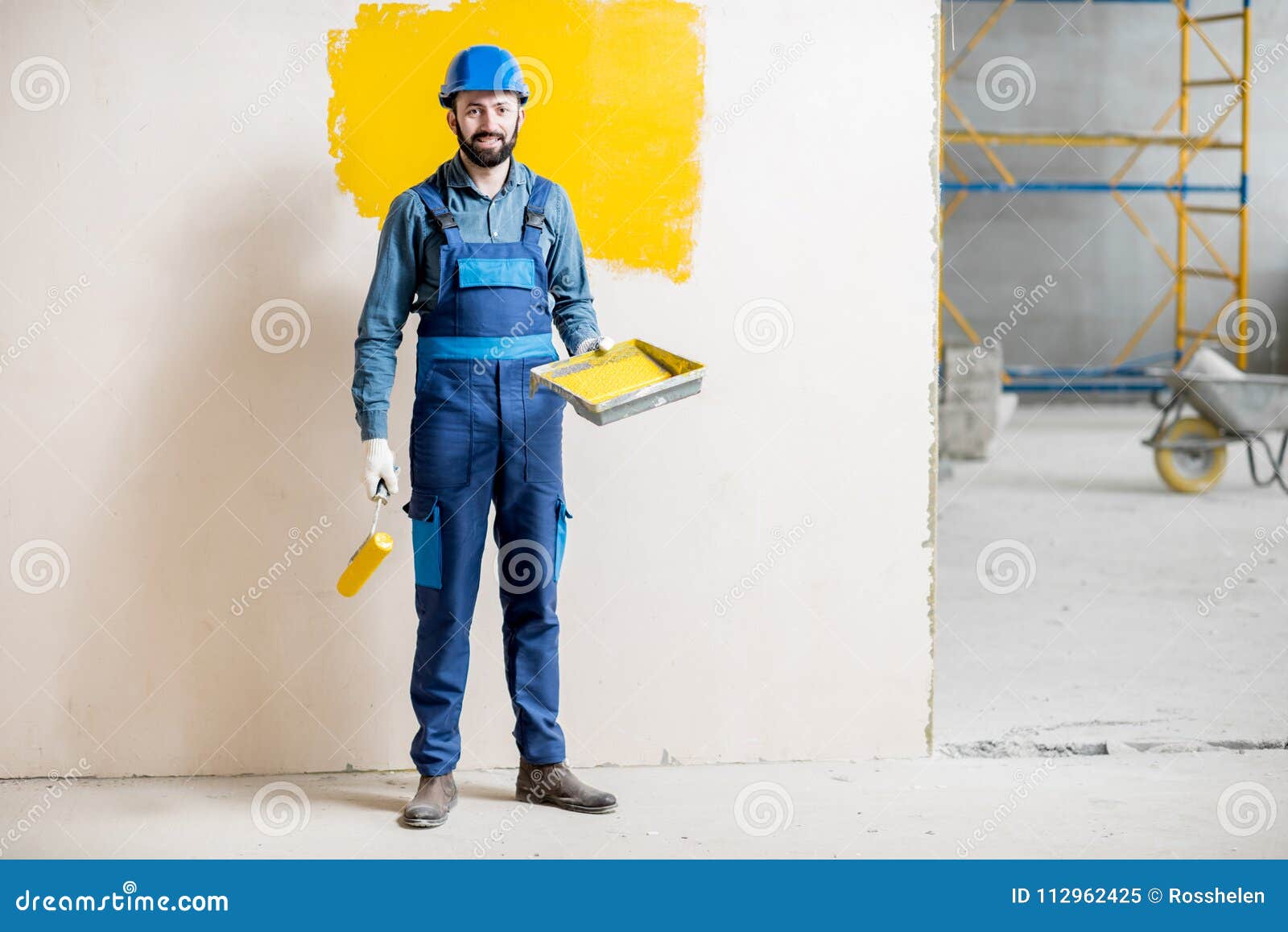 Painter at the Construction Site Stock Image - Image of handsome