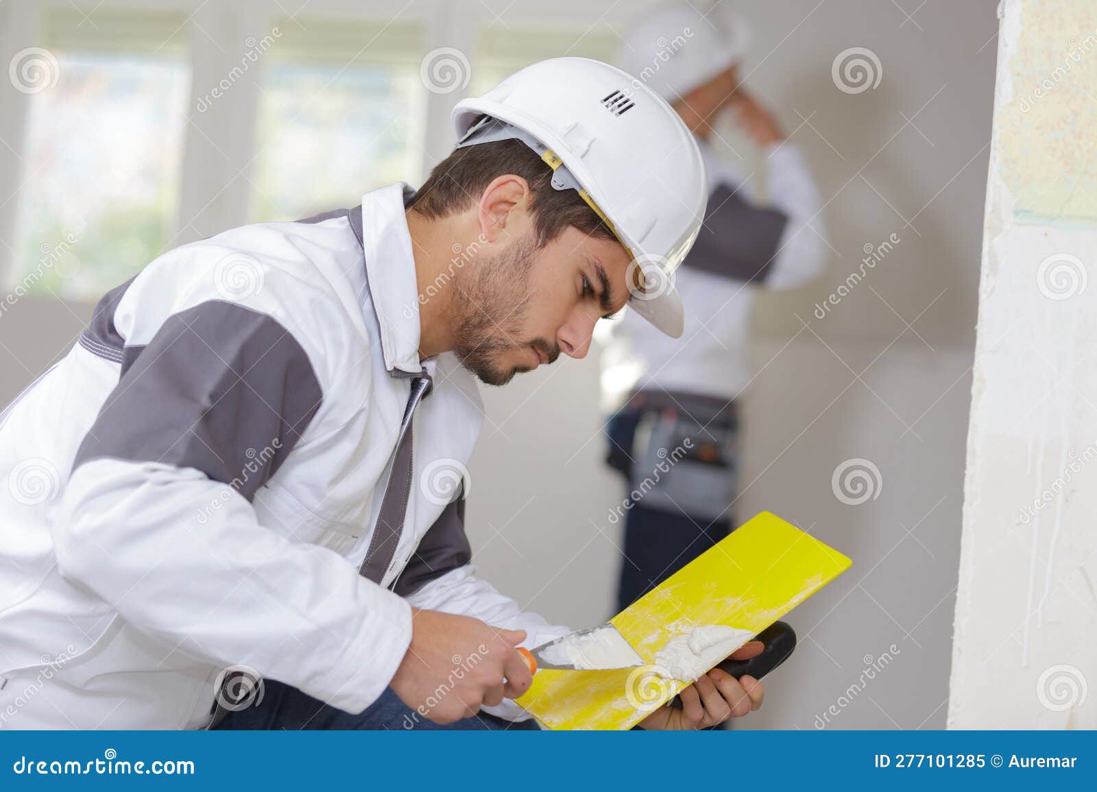 Painter mixing the filler stock image. Image of construct 277101285