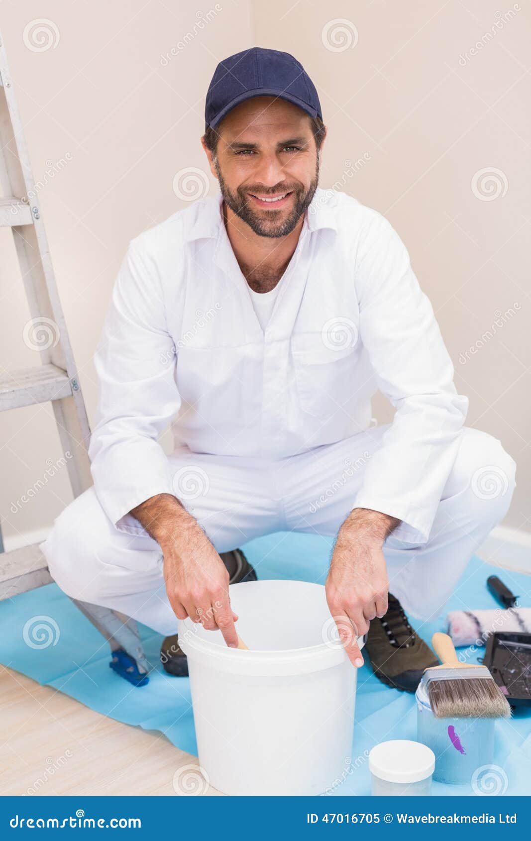 Painter Mixing Paint in a Bucket Stock Image Image of caucasian