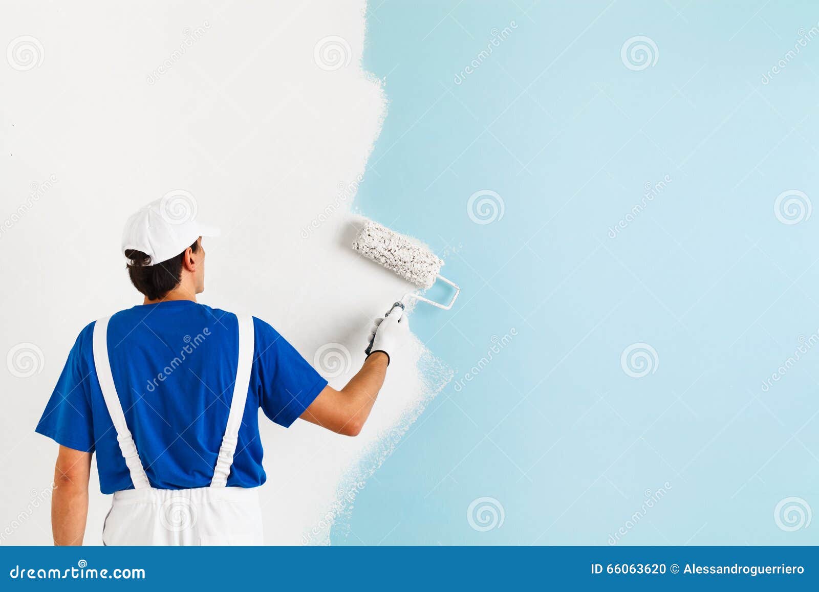 painter painting a wall with paint roller