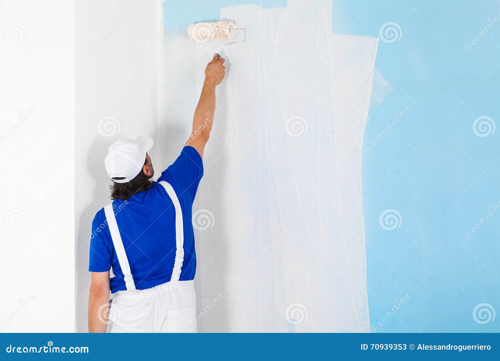 Painter Painting a Wall with Paint Roller Stock Image Image of
