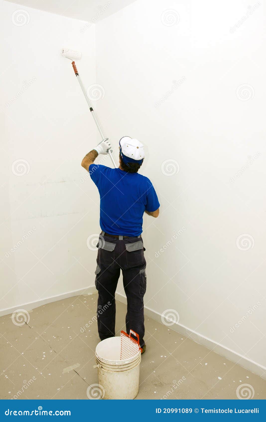Painter with a roll stock image. Image of adult, recreation 20991089
