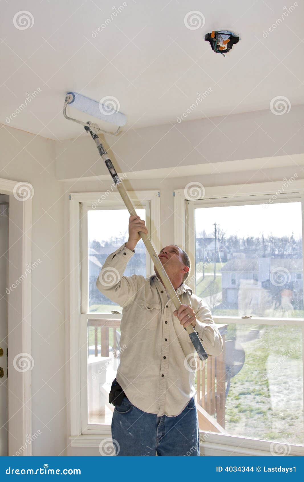 Painter Rolling Ceilings Stock Photo Image Of Occupation 4034344