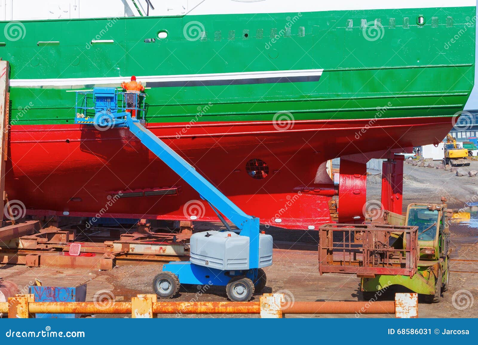 Painter Working on Repairing a Ship, Iceland Stock Image Image of