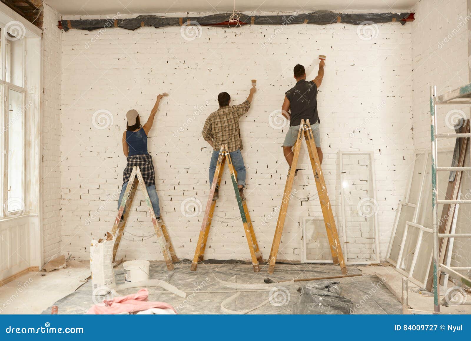 Painters Working on Renovation Site Stock Image Image of casual