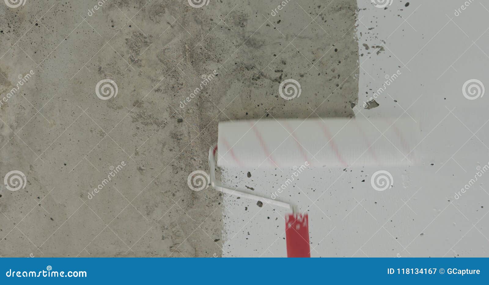 Painting Concrete Ceiling Into White With Roller Stock Image