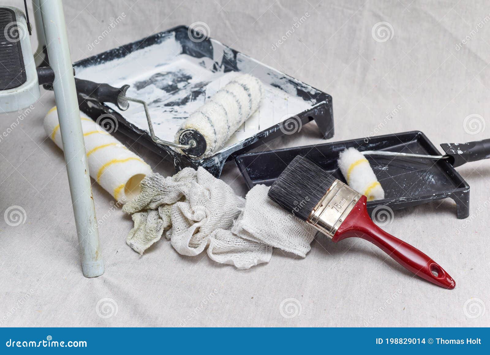 paint roller in tray, brushes, and paint can.decorating and house  renovation tools. painter and decorator working table.Painting tools and  accessories Stock Photo - Alamy